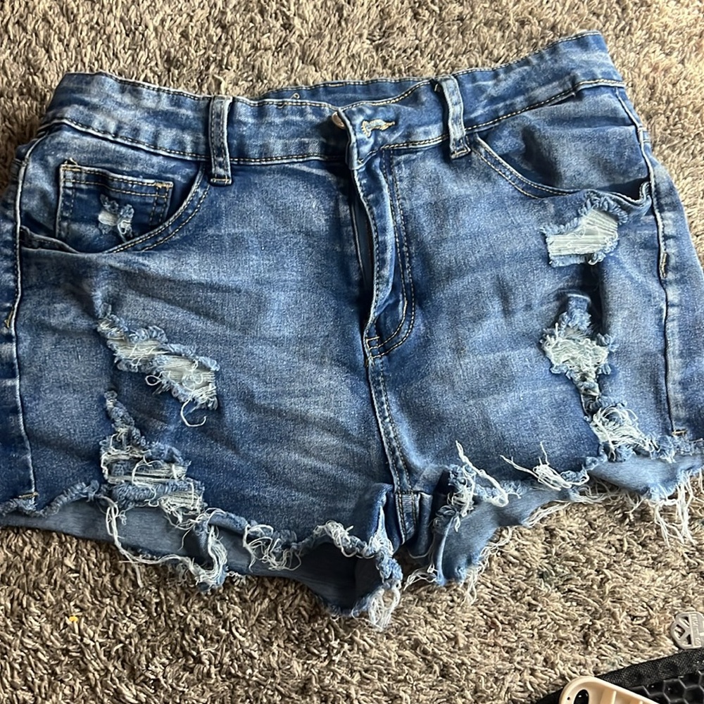 I am selling blue denim jeans shorts that are a size L